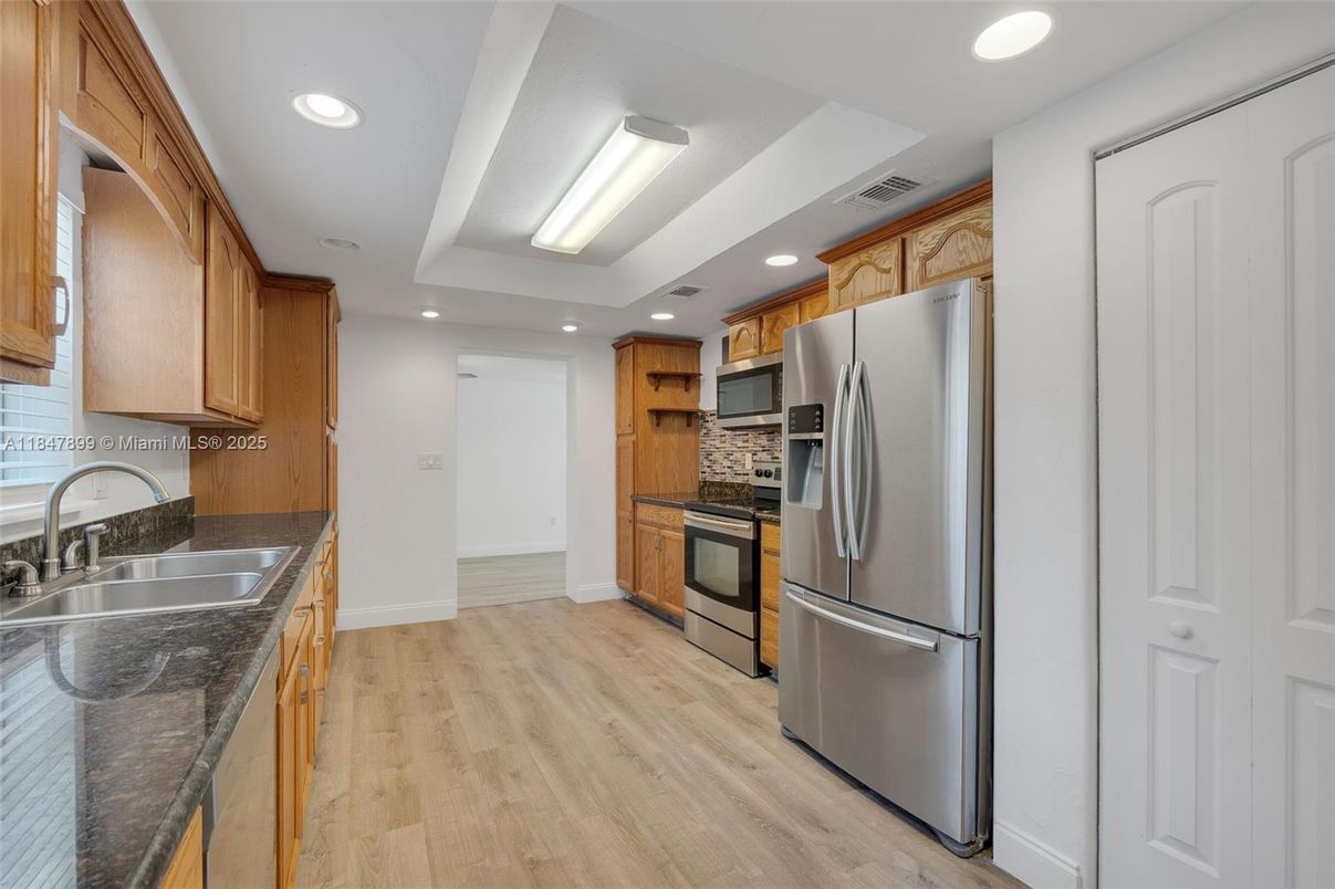 Interior, Kitchen, Recessed Lighting, Stainless Steel Appliances, Wood Texture Flooring