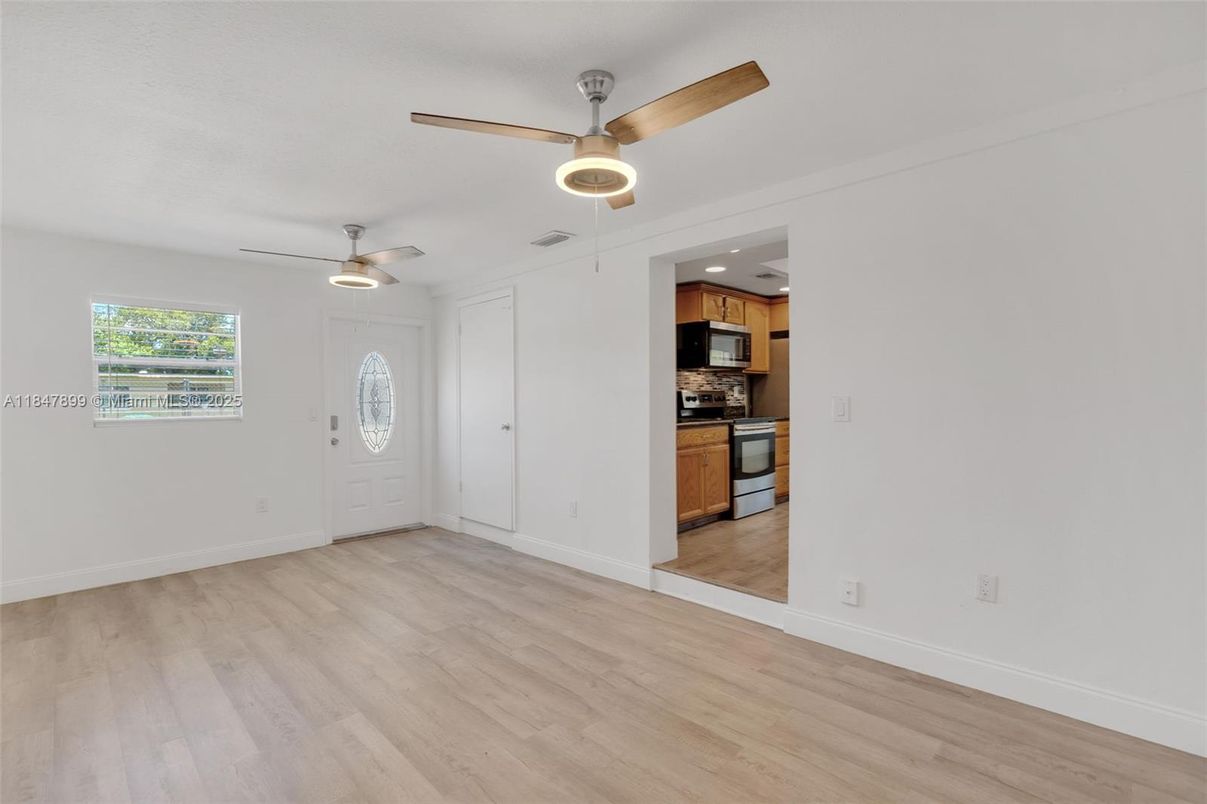 Empty room, Interior, Kitchen, Stainless Steel Appliances, Wood Texture Flooring