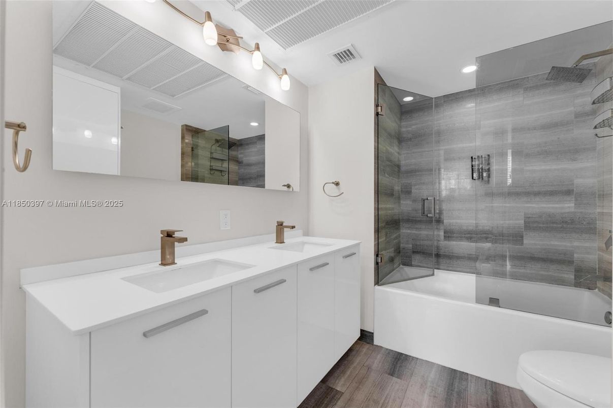 Bathroom, Dual Sink Vanities, Glass Shower, Interior, Recessed Lighting, Wood Texture Flooring