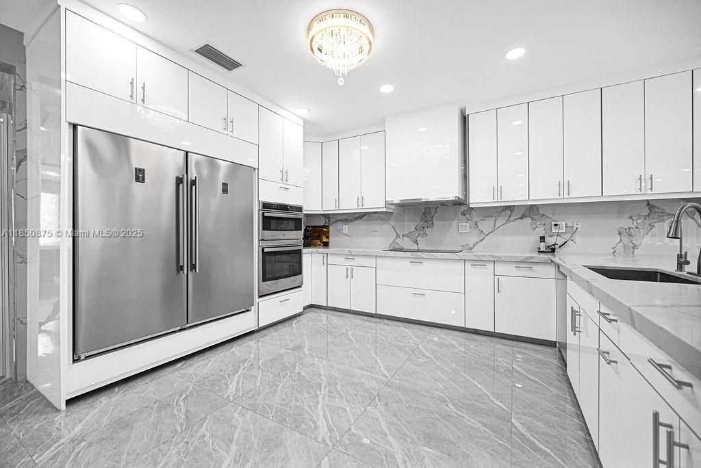 Chandelier, Interior, Kitchen, Marble, Marble Walls, Recessed Lighting, Stainless Steel Appliances