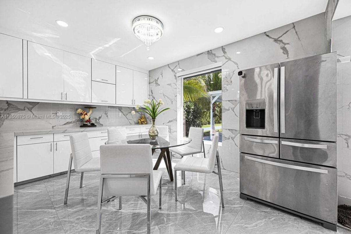 Chandelier, Dining room, Interior, Kitchen, Marble Walls, Recessed Lighting, Stainless Steel Appliances