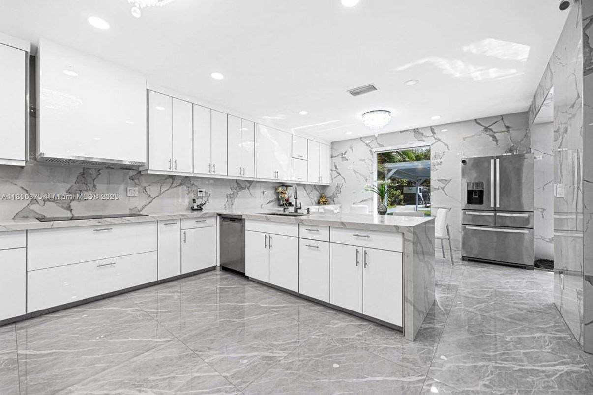 Interior, Kitchen, Marble Walls, Recessed Lighting, Stainless Steel Appliances