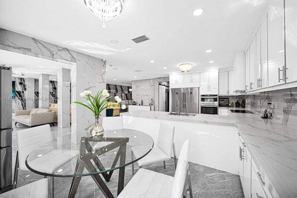Chandelier, Dining room, Interior, Kitchen, Marble Walls, Recessed Lighting, Stainless Steel Appliances