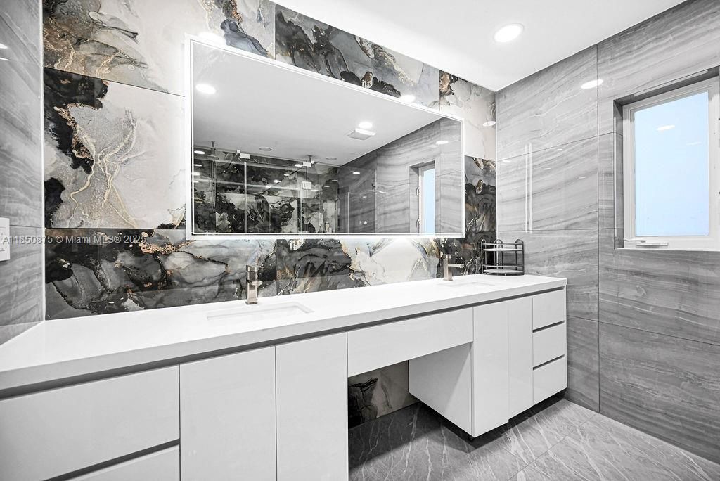 Bathroom, Dual Sink Vanities, Glass Shower, Interior, Marble Walls, Recessed Lighting