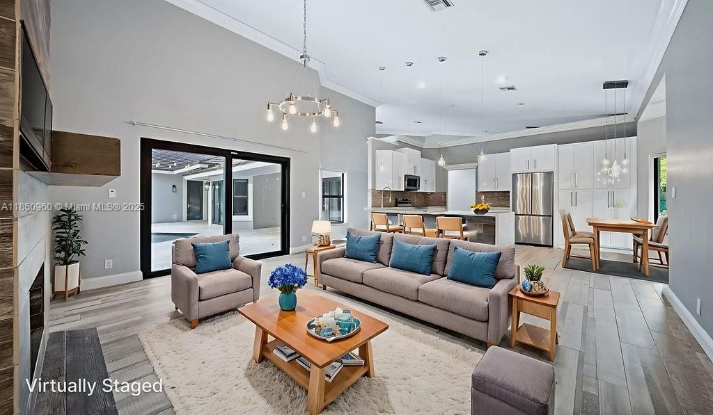 Dining room, Interior, Kitchen, Living room, Pendant Lights, Recessed Lighting, Stainless Steel Appliances, Wood Texture Flooring