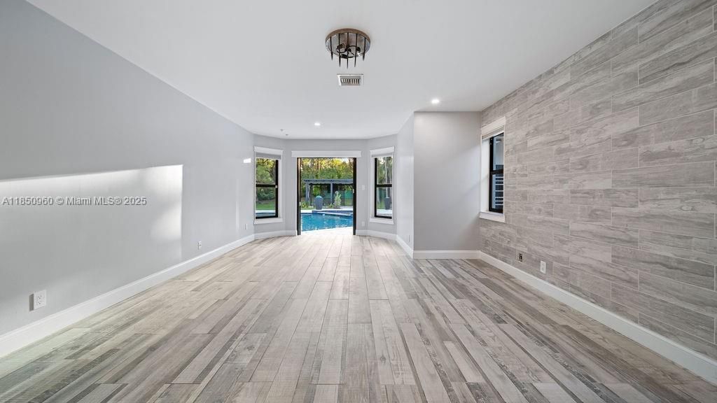 Empty room, Interior, Recessed Lighting, Stone Walls, Wood Texture Flooring