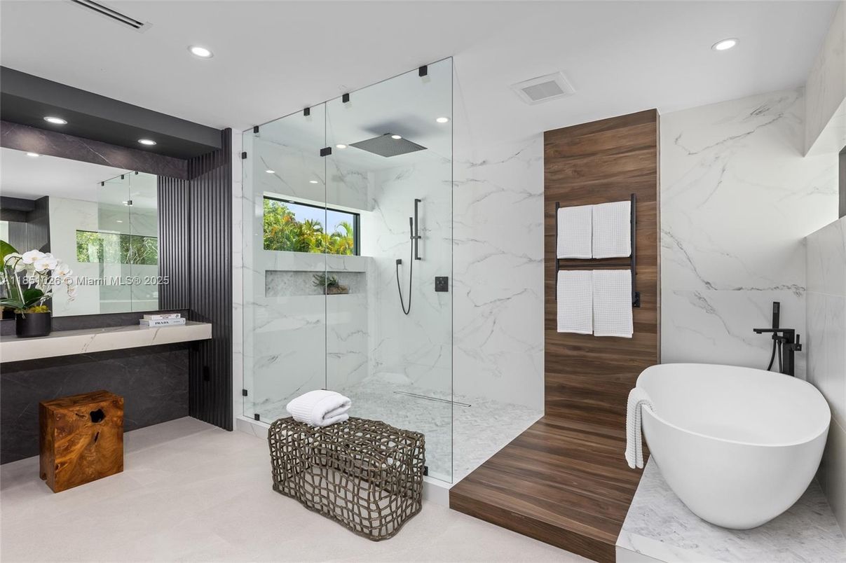 Bathroom, Free Standing Baths, Glass Shower, Interior, Marble Walls, Recessed Lighting, Wood Texture Flooring