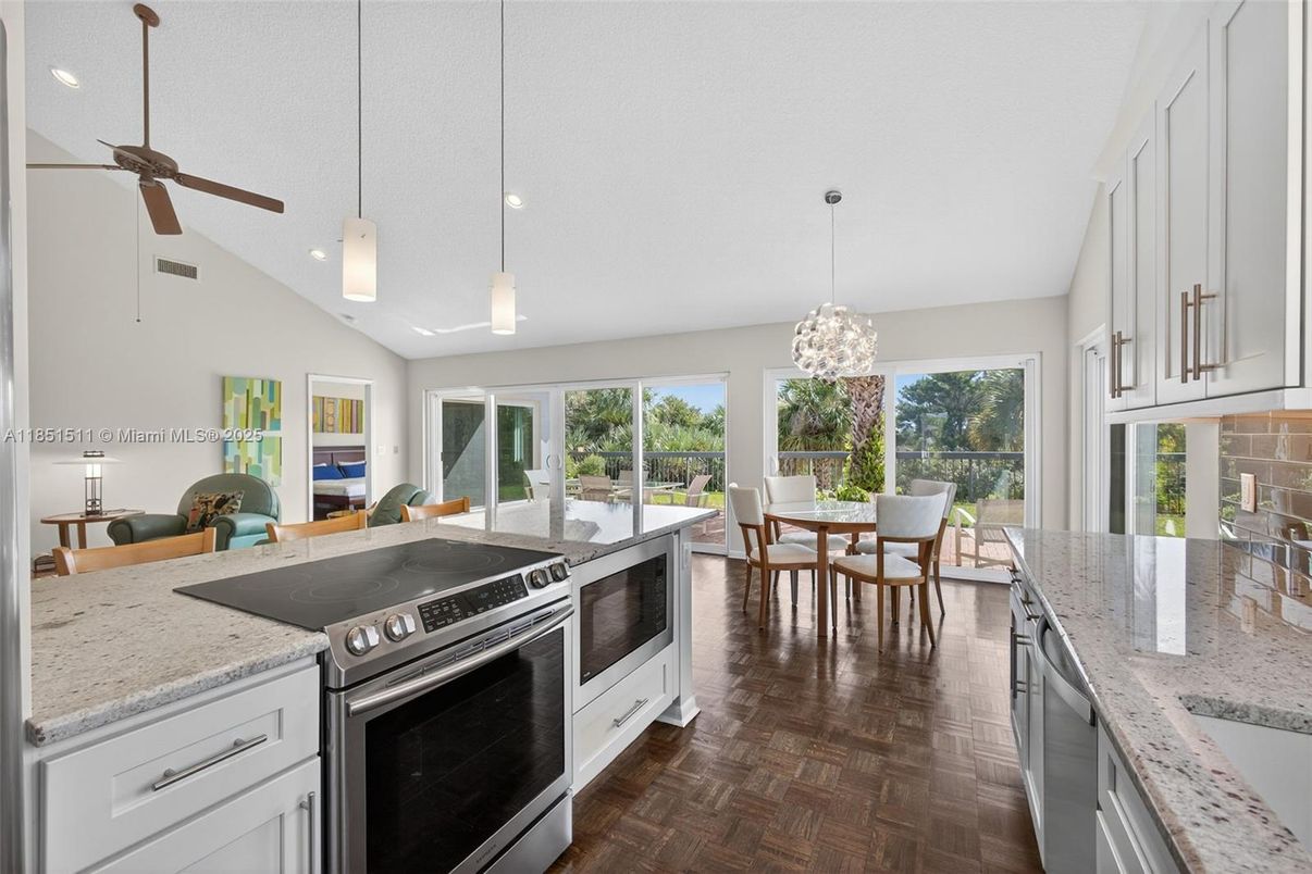 Dining room, Interior, Kitchen, Pendant Lights, Recessed Lighting, Stainless Steel Appliances, Wood Texture Flooring