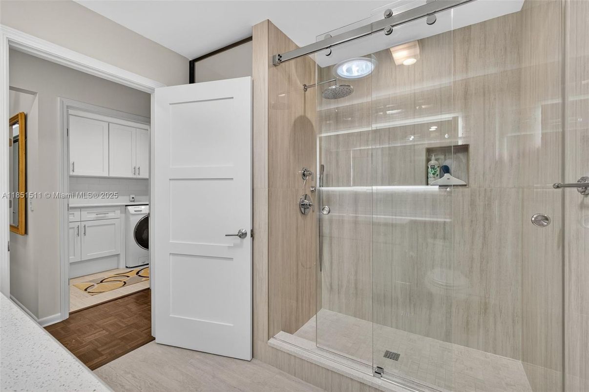 Bathroom, Glass Shower, Interior, Washer, Wood Texture Flooring