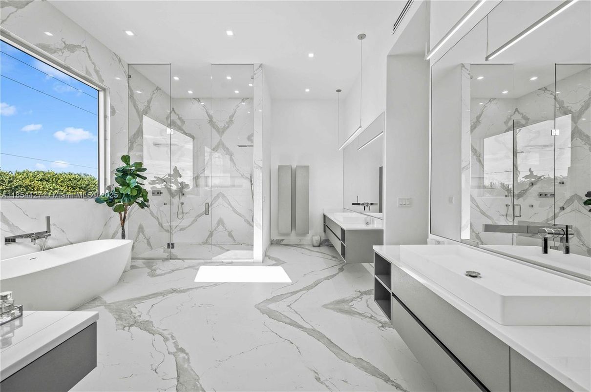 Bathroom, Dual Sink Vanities, Free Standing Baths, Glass Shower, Interior, Marble, Marble Walls, Pendant Lights, Recessed Lighting