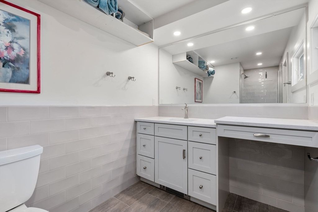 Bathroom, Dual Sink Vanities, Glass Shower, Interior, Recessed Lighting, Wood Texture Flooring