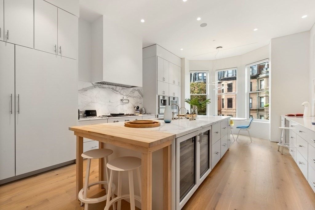 Interior, Kitchen, Marble Walls, Pendant Lights, Recessed Lighting, Stainless Steel Appliances, Wood Texture Flooring
