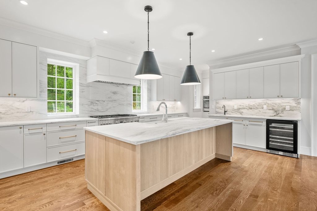 Interior, Kitchen, Marble Walls, Pendant Lights, Recessed Lighting, Stainless Steel Appliances, Wood Texture Flooring