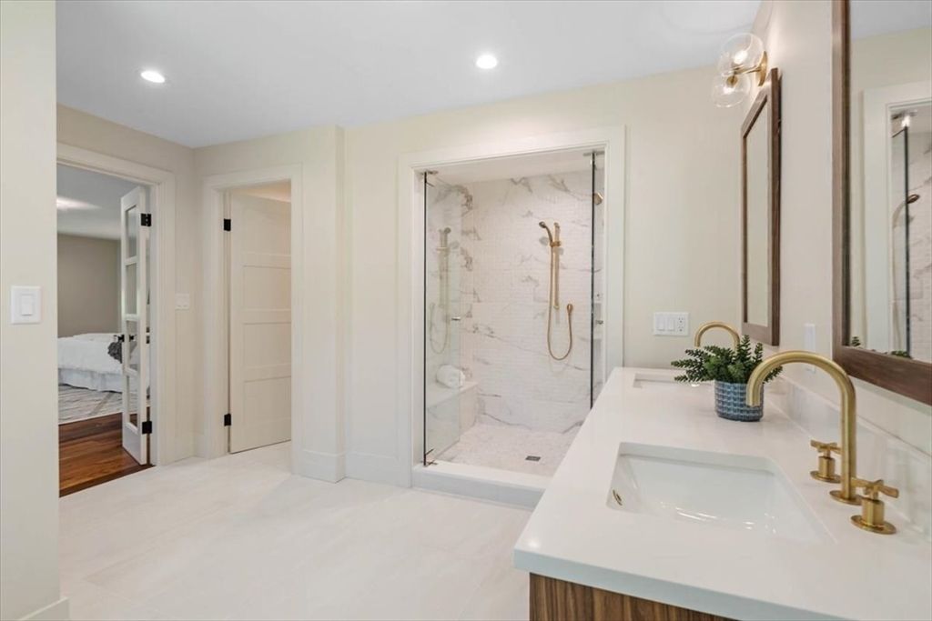 Bathroom, Bedroom, Dual Sink Vanities, Glass Shower, Interior, Marble Walls, Recessed Lighting, Wood Texture Flooring