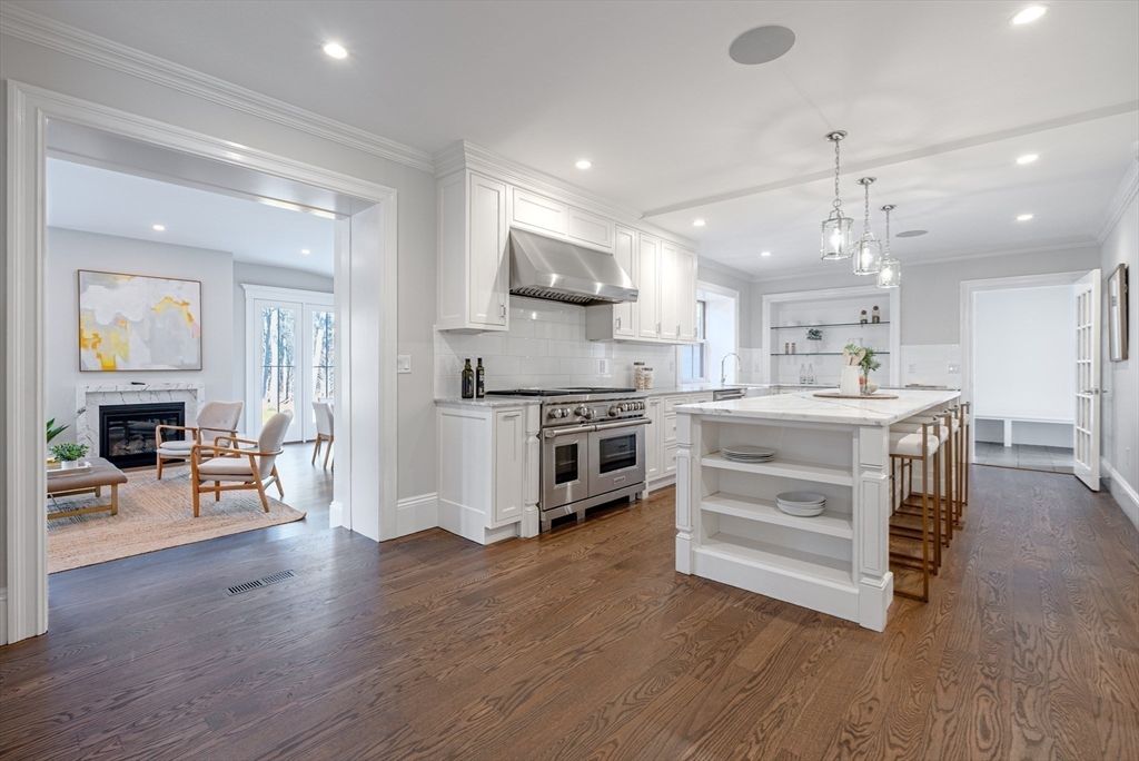 Fireplace, Interior, Kitchen, Living room, Pendant Lights, Recessed Lighting, Stainless Steel Appliances, Wood Texture Flooring