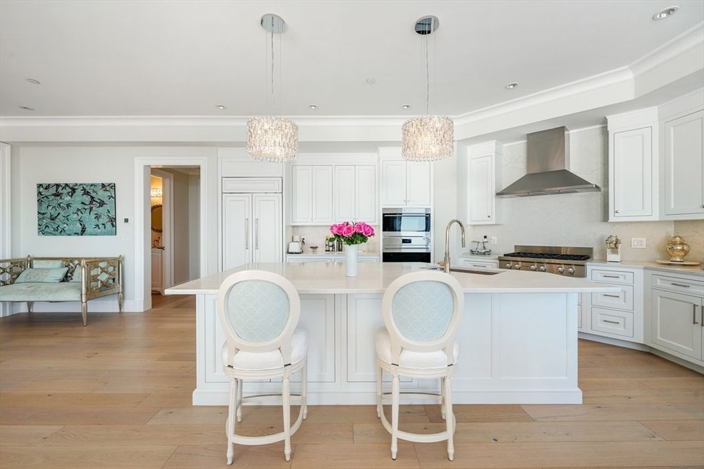 Chandelier, Dining room, Fireplace, Interior, Kitchen, Living room, Recessed Lighting, Stainless Steel Appliances, Wood Texture Flooring