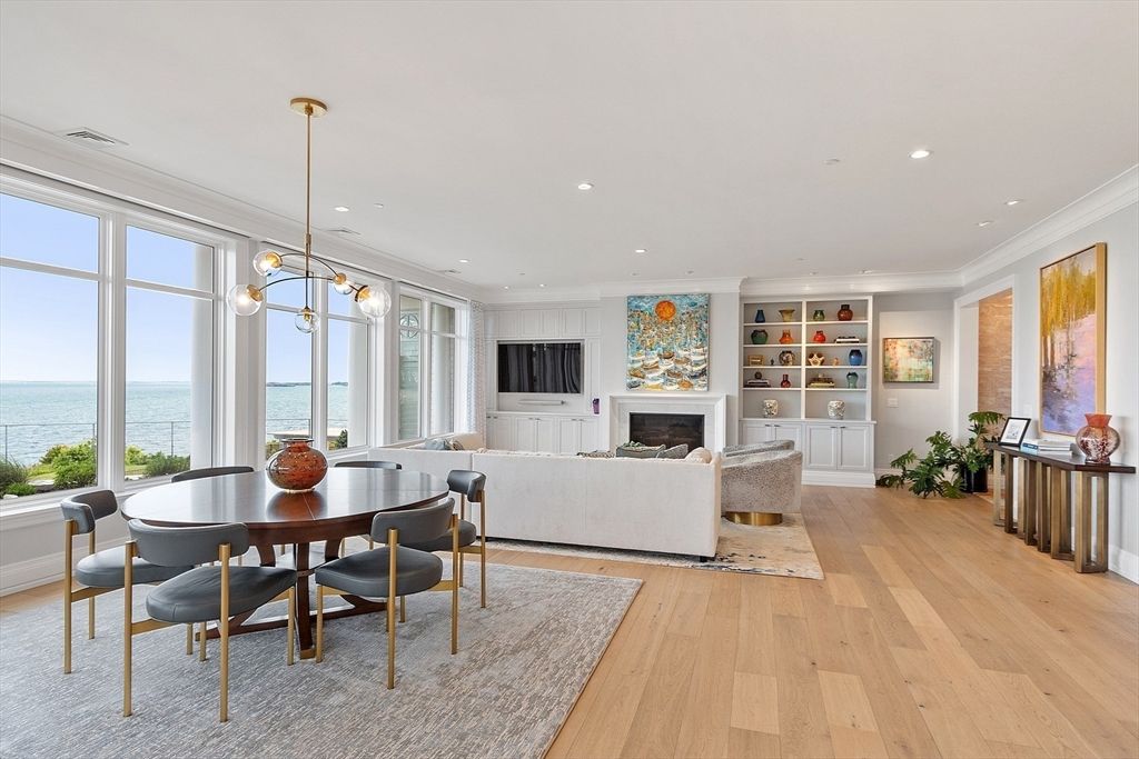 Dining room, Fireplace, Interior, Living room, Pendant Lights, Recessed Lighting, Water, Wood Texture Flooring