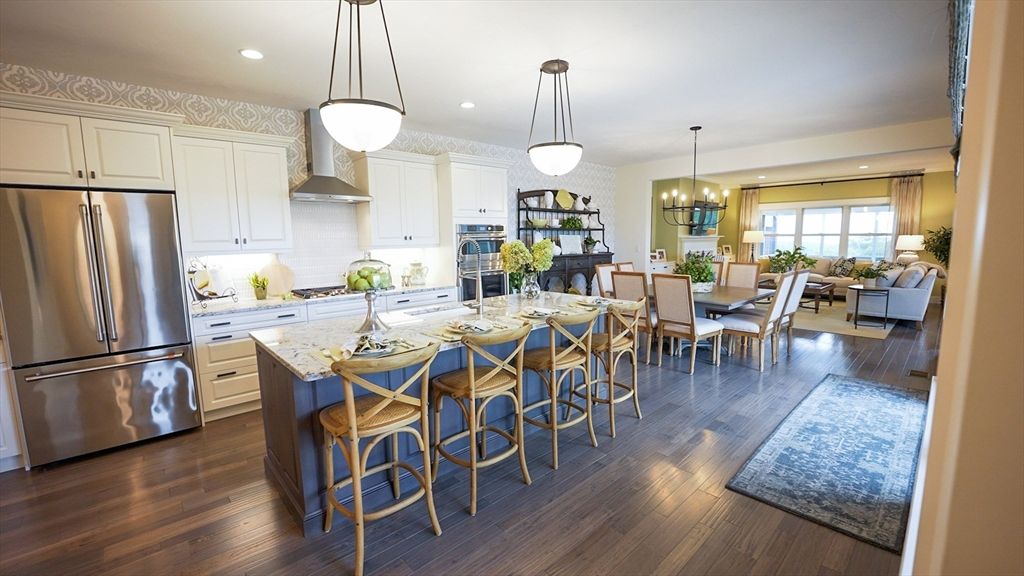 Chandelier, Dining room, Interior, Kitchen, Living room, Pendant Lights, Recessed Lighting, Stainless Steel Appliances, Wood Texture Flooring
