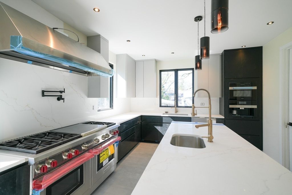 Interior, Kitchen, Marble Walls, Pendant Lights, Recessed Lighting, Stainless Steel Appliances