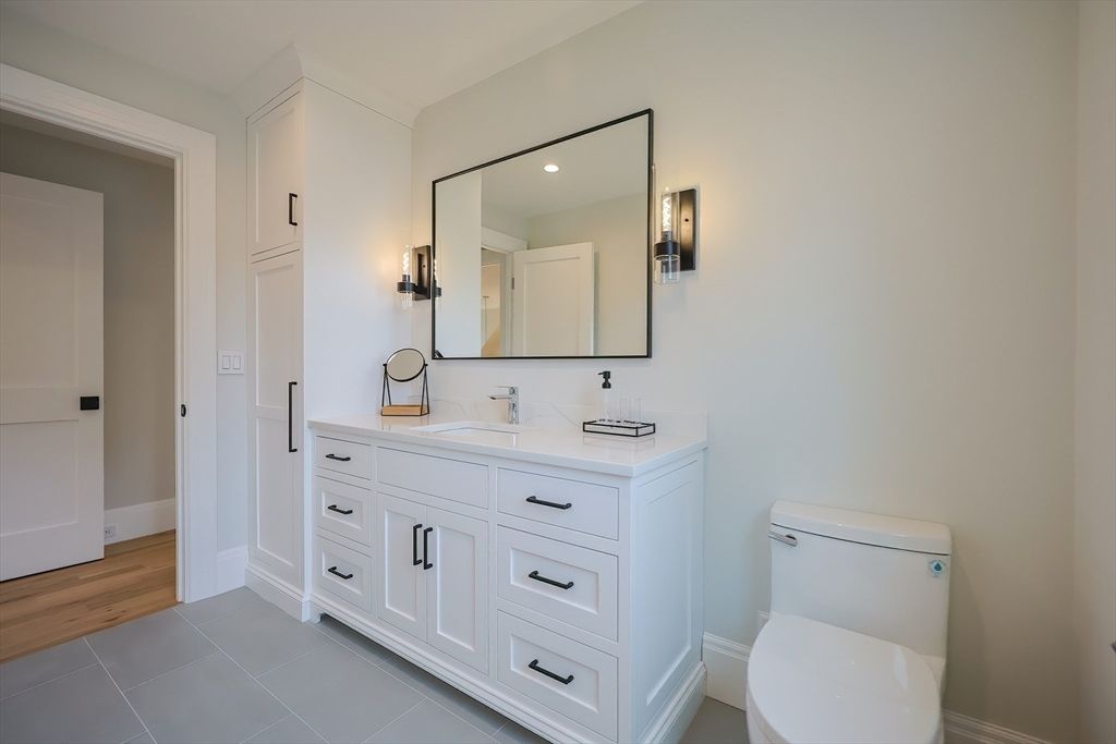 Bathroom, Dual Sink Vanities, Interior, Recessed Lighting, Wood Texture Flooring