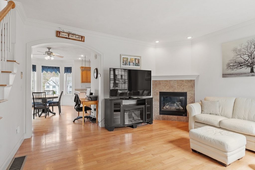 Dining room, Fireplace, Interior, Living room, Recessed Lighting, Wood Texture Flooring