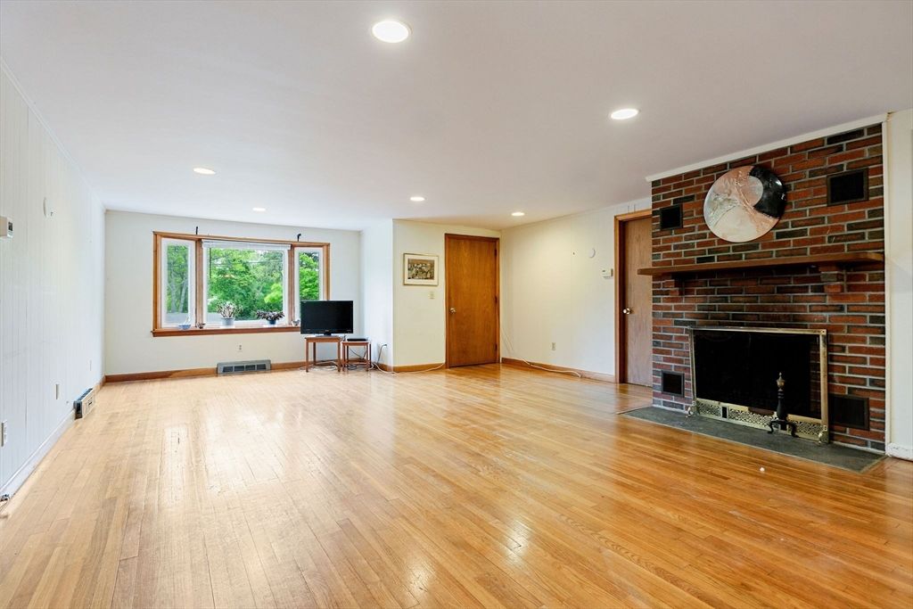 Empty room, Fireplace, Interior, Recessed Lighting, Stone Walls, Wood Texture Flooring
