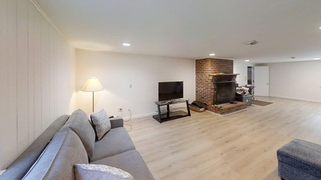 Fireplace, Interior, Living room, Recessed Lighting, Stone Walls, Wood Texture Flooring