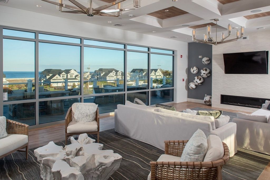 Chandelier, Fireplace, Interior, Living room, Recessed Lighting, Water, Wood Texture Flooring
