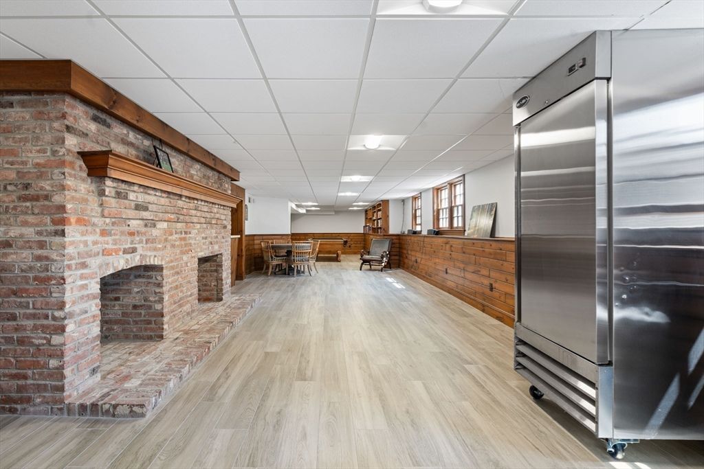 Dining room, Fireplace, Interior, Kitchen, Recessed Lighting, Stone Walls, Wood Texture Flooring