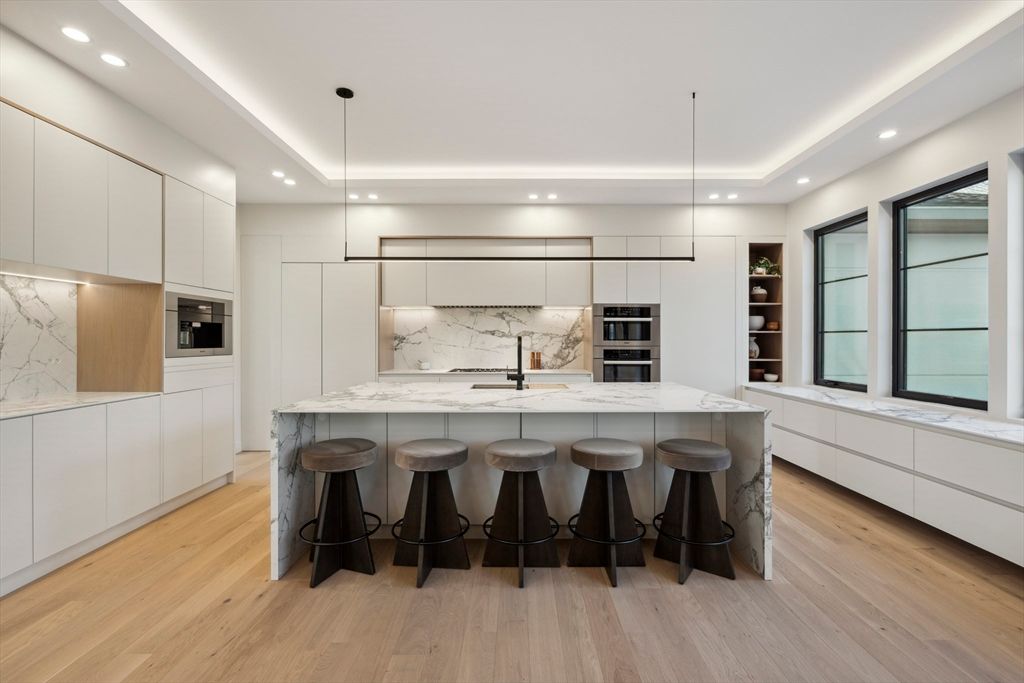 Interior, Kitchen, Marble Walls, Pendant Lights, Recessed Lighting, Stainless Steel Appliances, Wood Texture Flooring