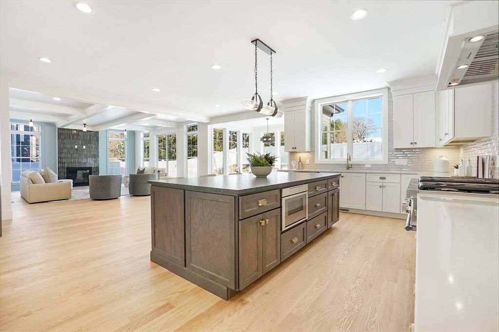 Fireplace, Interior, Kitchen, Living room, Pendant Lights, Recessed Lighting, Stainless Steel Appliances, Wood Texture Flooring