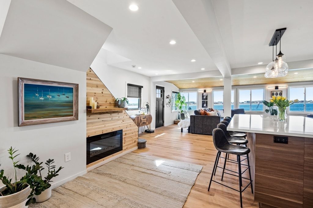 Fireplace, Interior, Living room, Pendant Lights, Recessed Lighting, Water, Wood Texture Flooring, Wooden Walls