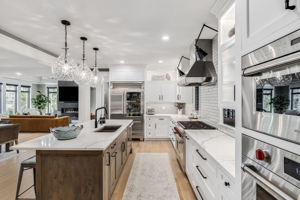 Fireplace, Interior, Kitchen, Living room, Pendant Lights, Recessed Lighting, Stainless Steel Appliances, Wood Texture Flooring