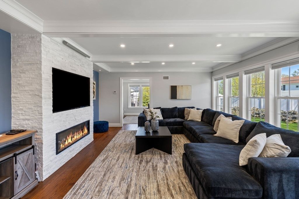 Fireplace, Interior, Living room, Recessed Lighting, Stone Walls, Wood Texture Flooring