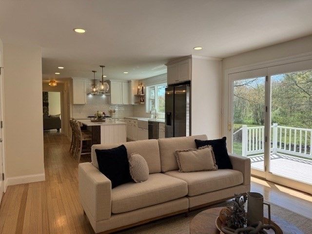 Chandelier, Dining room, Interior, Kitchen, Living room, Pendant Lights, Recessed Lighting, Stainless Steel Appliances, Wood Texture Flooring