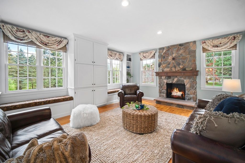 Fireplace, Interior, Living room, Recessed Lighting, Stone Walls, Wood Texture Flooring