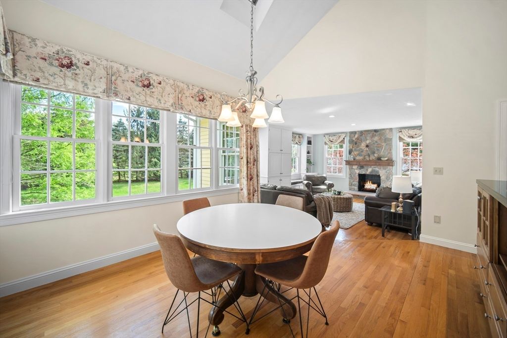 Chandelier, Dining room, Fireplace, Interior, Living room, Pendant Lights, Recessed Lighting, Wood Texture Flooring
