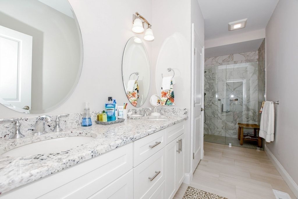 Bathroom, Dual Sink Vanities, Glass Shower, Interior, Marble Walls, Recessed Lighting