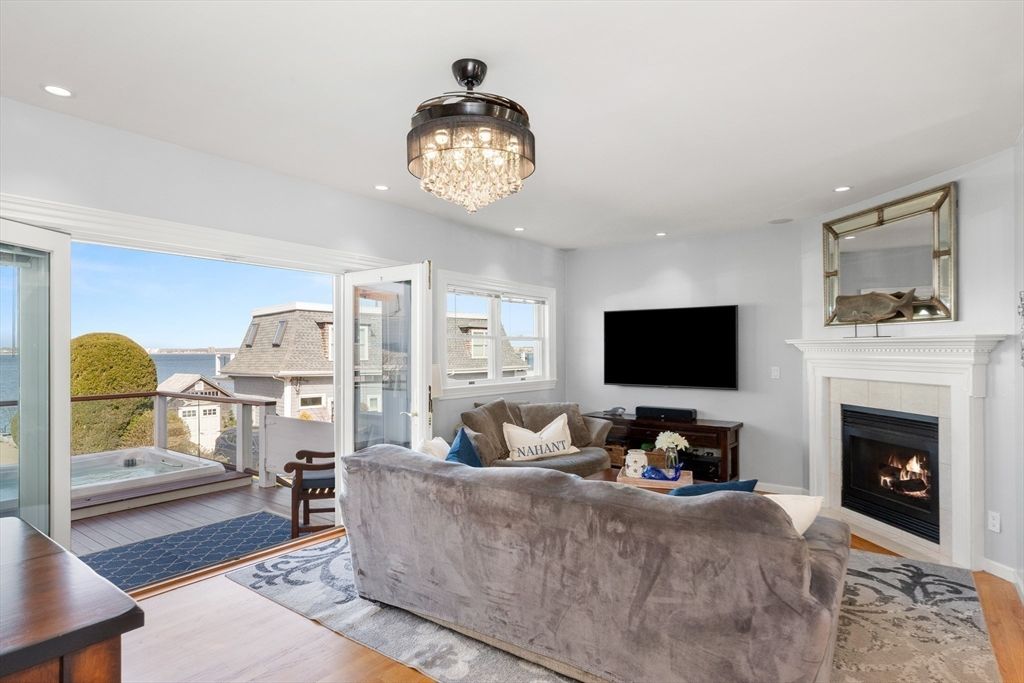 Chandelier, Fireplace, Interior, Living room, Recessed Lighting, Water, Wood Texture Flooring