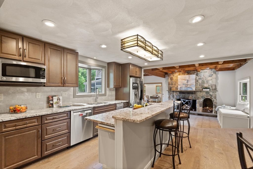 Fireplace, Interior, Kitchen, Recessed Lighting, Stainless Steel Appliances, Stone Walls, Wood Texture Flooring