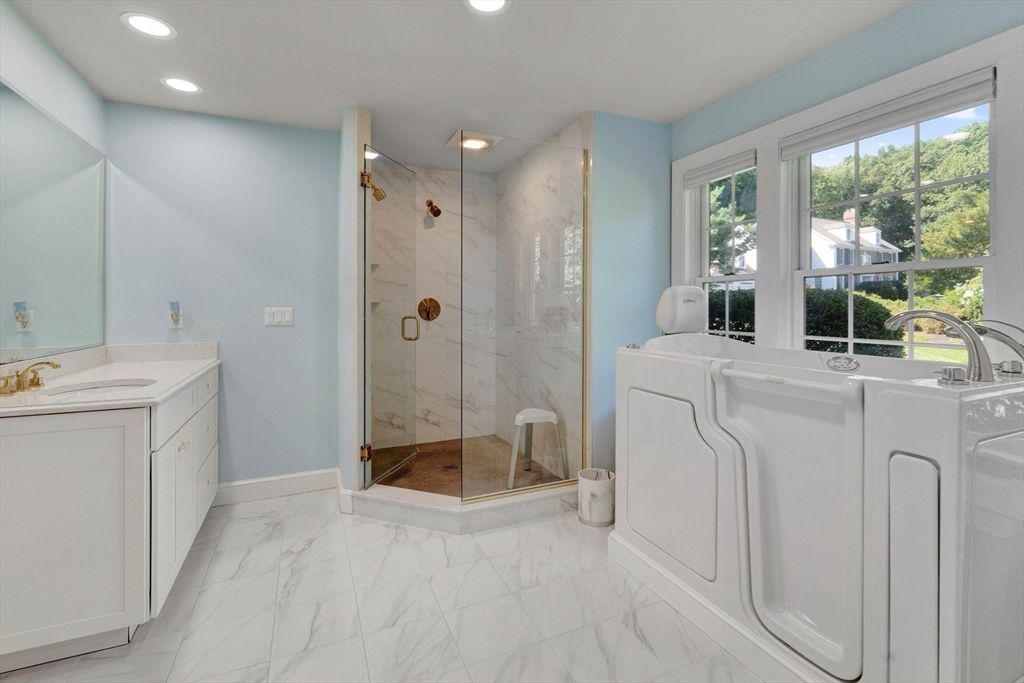 Bathroom, Dual Sink Vanities, Glass Shower, Interior, Marble, Marble Walls, Recessed Lighting