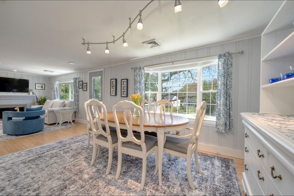 Dining room, Fireplace, Interior, Living room, Recessed Lighting, Wood Texture Flooring