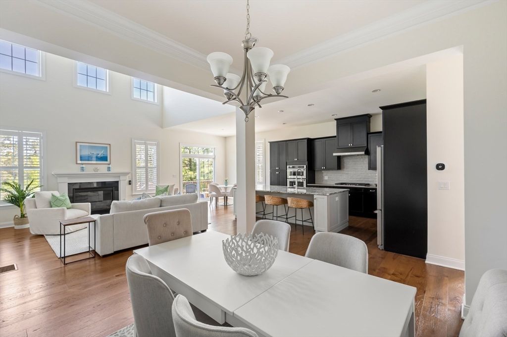 Chandelier, Dining room, Fireplace, Interior, Kitchen, Living room, Stainless Steel Appliances, Wood Texture Flooring