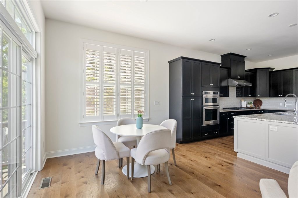 Dining room, Interior, Kitchen, Recessed Lighting, Stainless Steel Appliances, Wood Texture Flooring