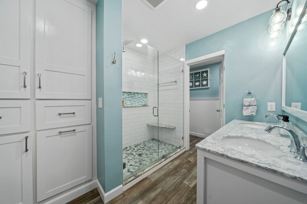 Bathroom, Dual Sink Vanities, Glass Shower, Interior, Recessed Lighting, Wood Texture Flooring