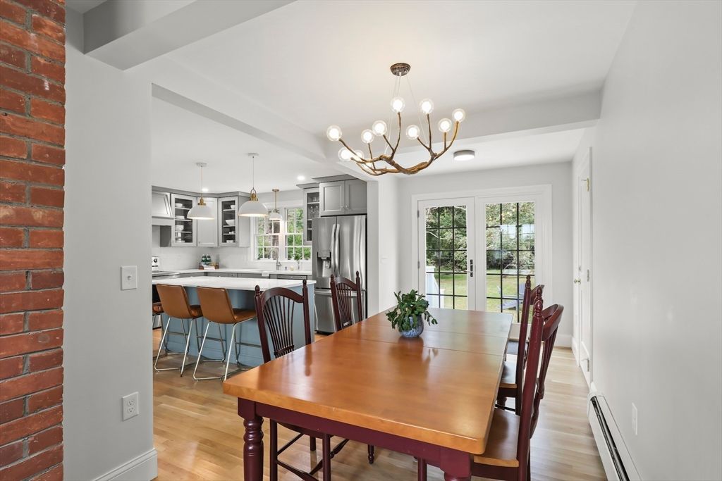 Chandelier, Dining room, Interior, Kitchen, Pendant Lights, Stainless Steel Appliances, Stone Walls, Wood Texture Flooring