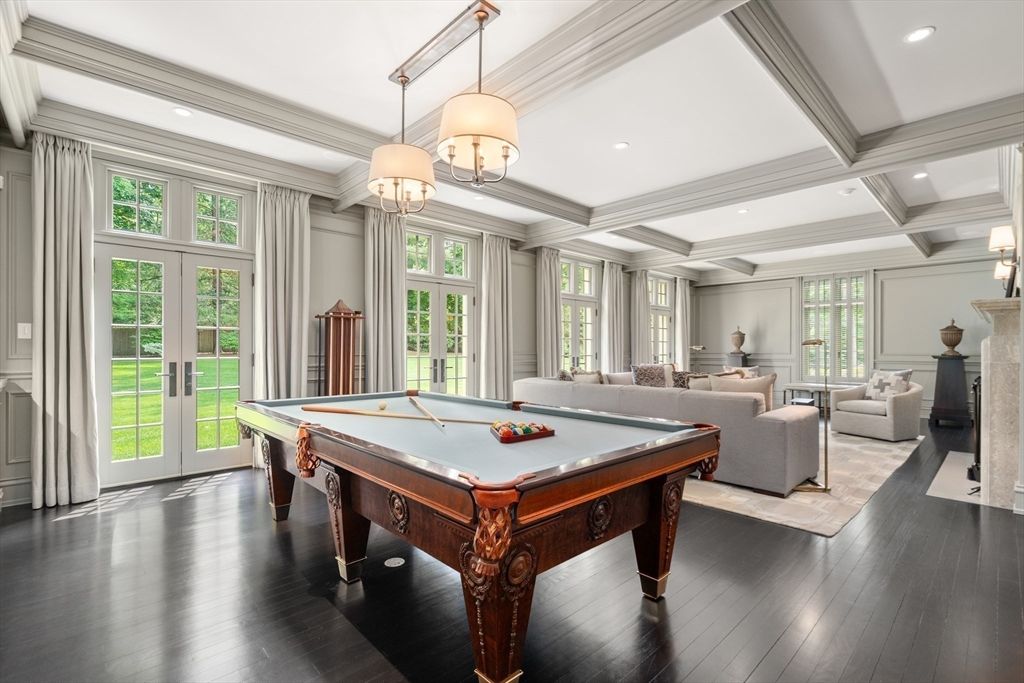 Billiard Table, Chandelier, Fireplace, Game Room, Interior, Living room, Pendant Lights, Recessed Lighting, Wood Texture Flooring