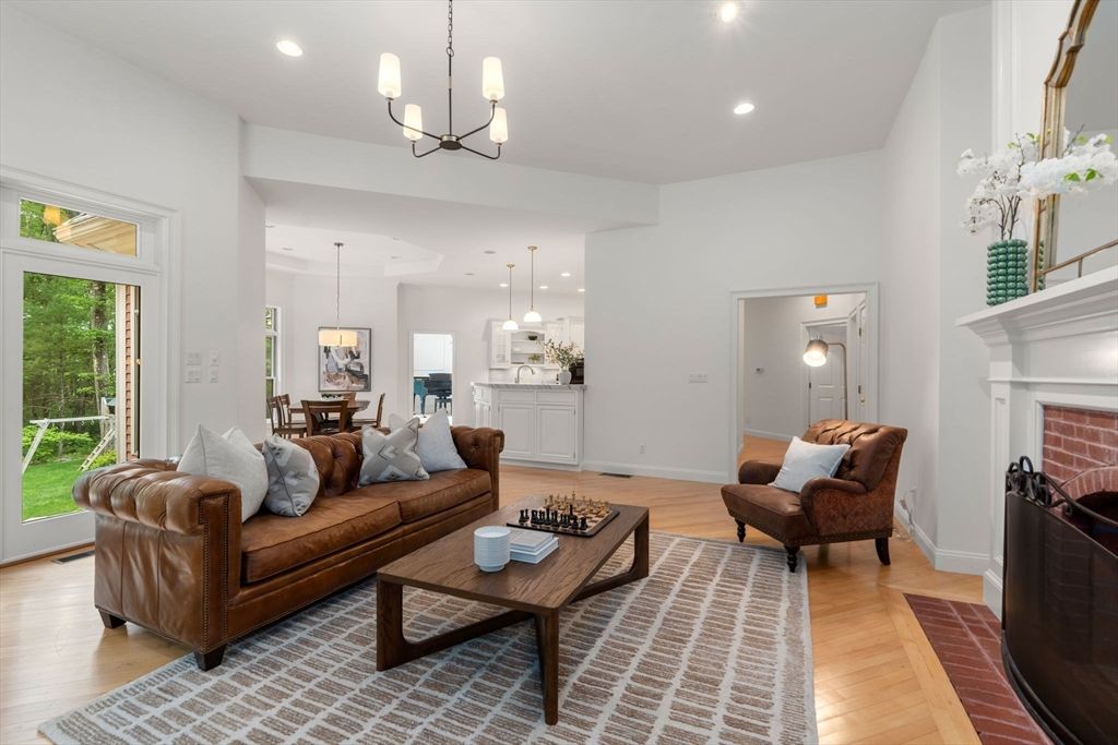 Chandelier, Dining room, Fireplace, Interior, Living room, Pendant Lights, Recessed Lighting, Wood Texture Flooring