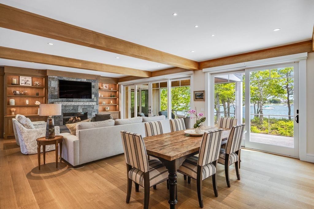 Dining room, Fireplace, Interior, Living room, Recessed Lighting, Water, Wooden Beams, Wood Texture Flooring