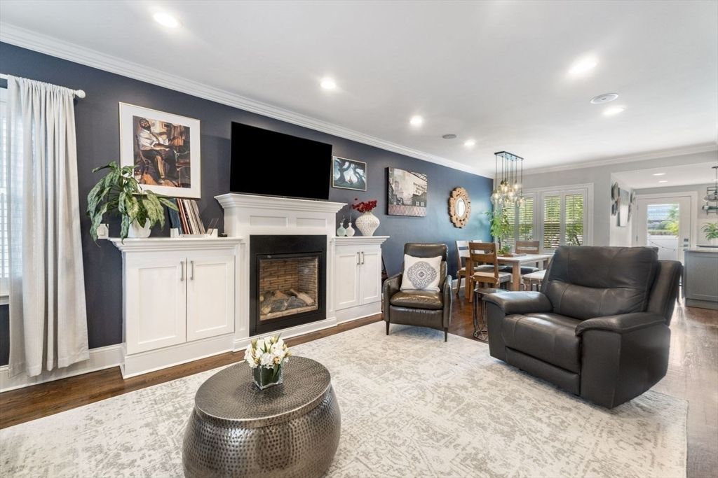 Chandelier, Dining room, Fireplace, Interior, Living room, Pendant Lights, Recessed Lighting, Wood Texture Flooring